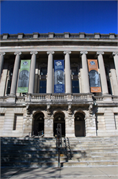 Front entrance of the Society headquarters building with banners.