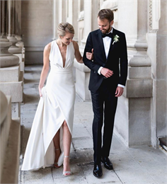 wedding couple holding hands outside