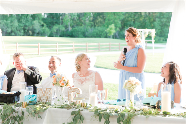 A woman (maid of honor) gives a speech on the Lawns of Wade House during a wedding ceremony