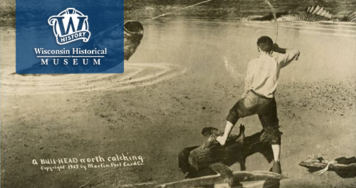 Wisconsin Historical Museum. A man fishing catches an unreal sized fish. The photo is captioned 'A bull-head worth catching'.